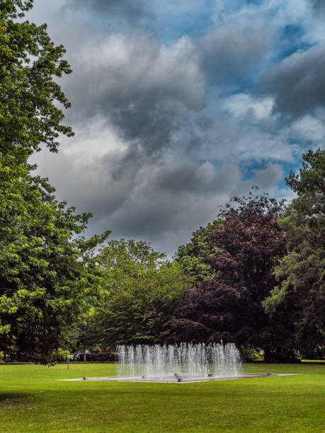 istock Peaceful Fountain in a Green Park Setting with Lush Trees in Kiel Germany 2183427321