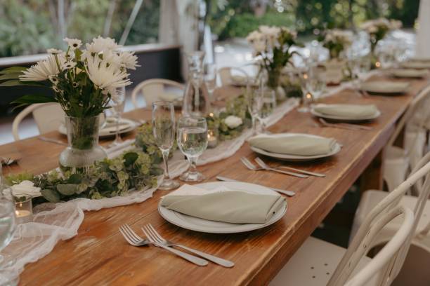 istock Elegant wedding table setting with flowers and glasses, perfect for a romantic celebration 2183428303