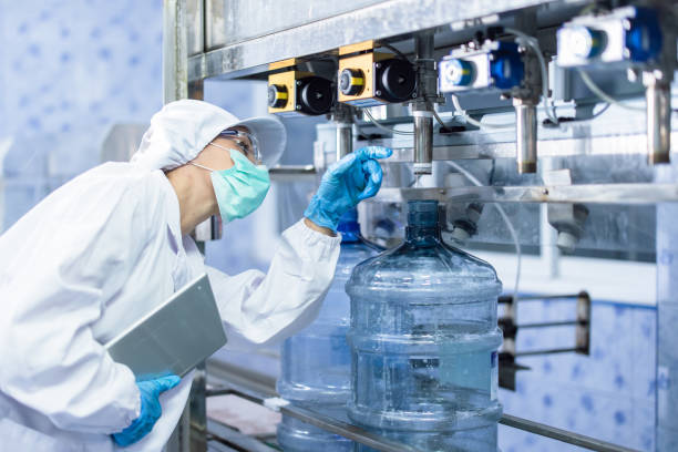 istock Worker people working in Drinking water factory, Hygiene uniform cleanliness workplace with clean care. 2183428965