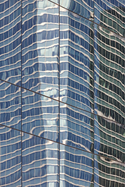 Reflexions on a skyscraper. Financial district. Five towers. Madrid, Spain