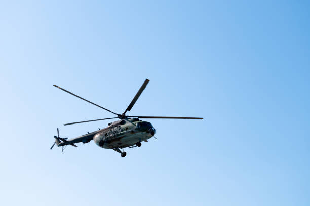 istock Military large aircraft flies over a clear blue sky, close-up 2183438312