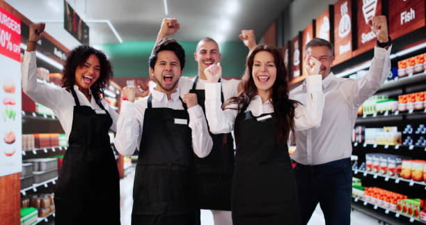 istock Happy Supermarket Employees In Shop 2183439331