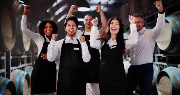 istock Happy Wine Cellar Employees In Shop 2183439342