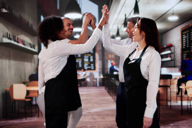 istock Happy Successful Store Team Giving High Five 2183439360