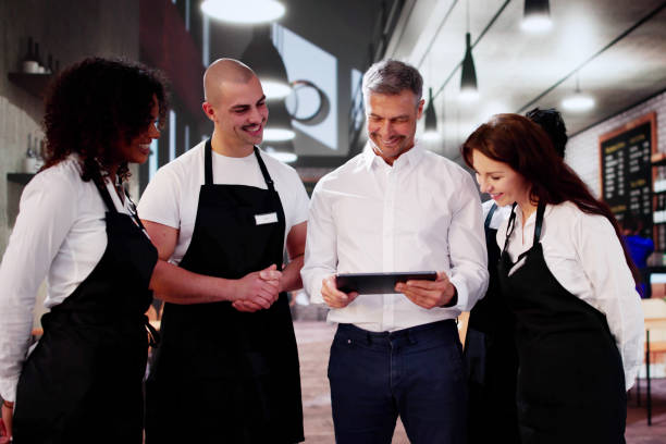 istock Store Manager In Coffee Shop Meeting With Team 2183439367