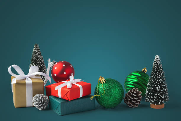 istock Christmas background, gift boxes with christmas ball and decor on green background 2183439825