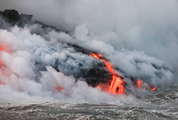 istock Red hot lava flowing into Pacific Ocean on Big Island, Hawaii 2183441699