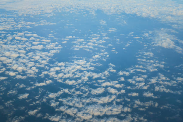 Endless cloudscape forming a sea of clouds, aerial view from airplane