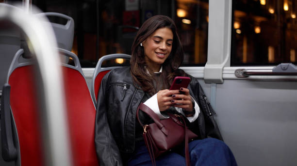 istock Young woman surfing the net during a night bus ride 2183447032