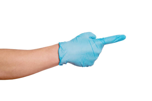 istock Men's hand wearing protective gloves with index finger pointing to something. isolated on white background. Medicine or cleaning 2183447084