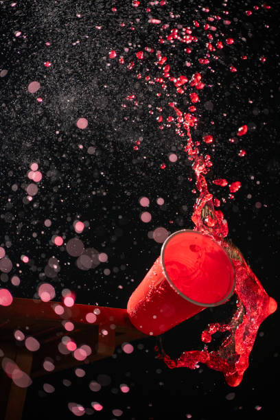 istock A red plastic cup splashes with vibrant red liquid in a dramatic freeze-frame shot, capturing the lively essence of Beer Fest celebrations. The liquid forms dynamic patterns against a dark backdrop 2183451426