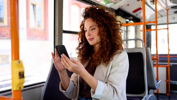 istock Attractive woman enjoying a walk and using smartphone 2183453359