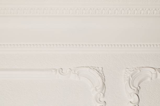 istock white wall with fancy crown moulding 2183454329