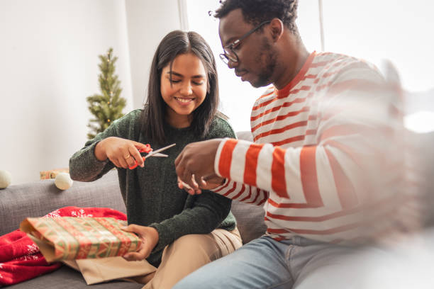 istock Couple packing presents at home 2183455802
