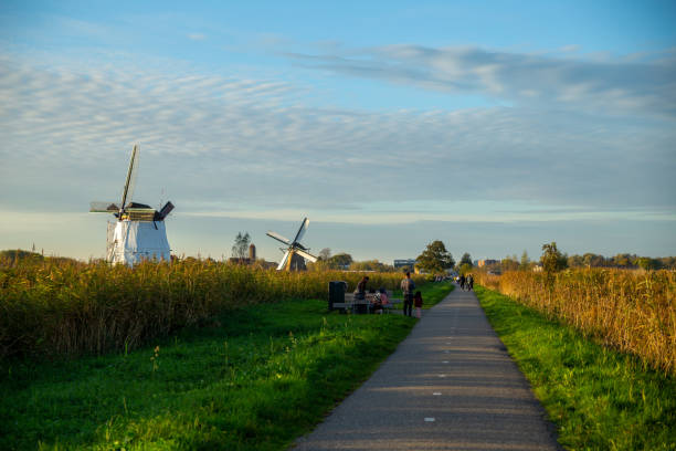 istock kinderdijk, Netherlands—Oct 26, 2024: the tourists visiting the kinderdijk at sunset 2183455868