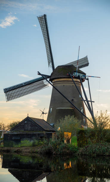 istock a windmill with a small house at kinderdijk in Netherlands, travel background image 2183455893