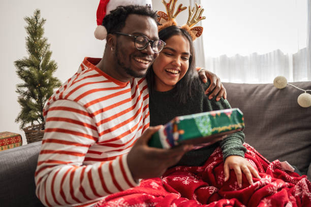 istock Lovely couple spending Christmas morning at home 2183456081