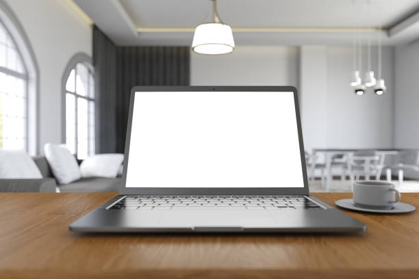 istock Blank Screen Laptop On The Table With Blurred Living Room Background 2183458894