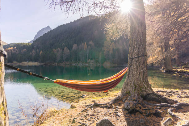 istock Empty Hammock Overlooking Scenic Lake and Autumn Mountains 2183459813