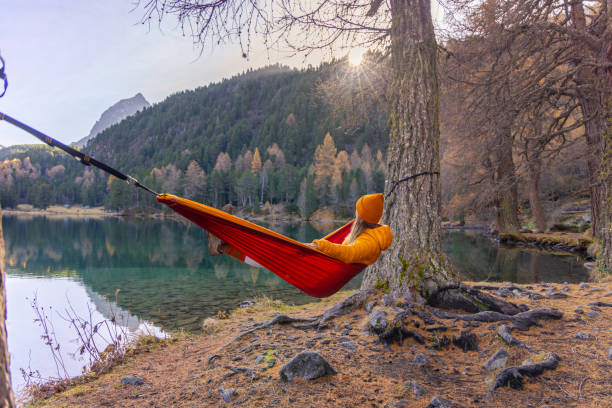 istock Relaxing in a Hammock by a Tranquil Autumn Lake 2183459993