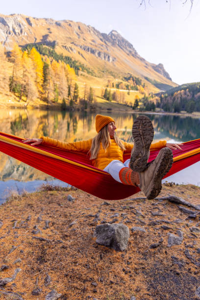 istock Relaxing in a Hammock by a Tranquil Autumn Lake 2183460028