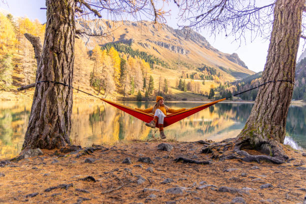 istock Relaxing in a Hammock by a Tranquil Autumn Lake 2183460116
