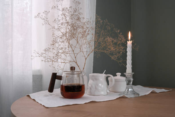istock A Cozy Tea Setup Featuring a Beautiful Candle and Delicate Dried Flowers for Ambiance 2183460161