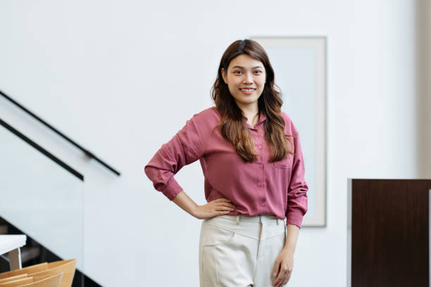 istock Successful Asian Chinese female entrepreneur looking at camera smiling 2183460981
