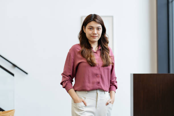 istock Successful Asian Chinese female entrepreneur looking at camera smiling 2183461074