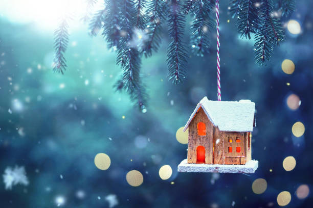 istock christmas tree with burning candle house 2183461373