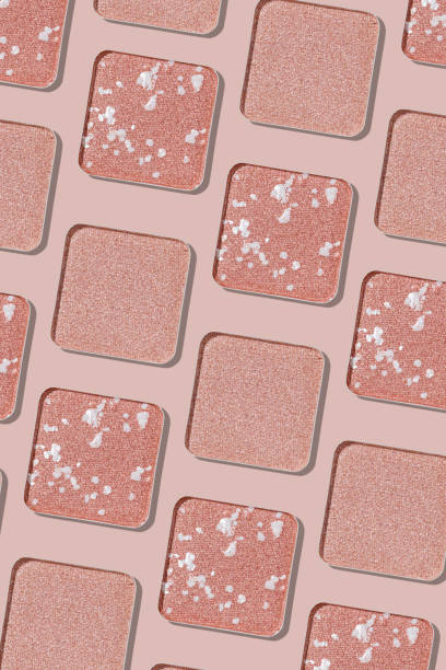 istock Swatches eyeshadow refills as minimal graphic pattern. Monochrome Matte, glitter pans pale pink shade, detailed texture, natural light, minimal cosmetics background, beauty product, eye makeup 2183467260