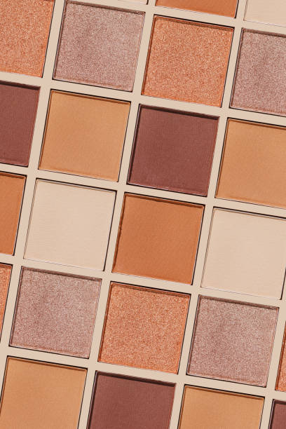 istock Swatches eyeshadow refills as minimal graphic pattern. Matte and glitter pans beige brown copper shade, detailed texture, sun light, minimal trend cosmetics background, beauty product, eye makeup 2183467262