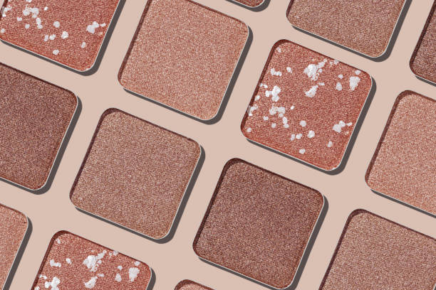 istock Cosmetics texture pattern, makeup palette vivid neutral color eye shadow, square eye powder swatches. Female cosmetic and beauty products, aesthetic minimal beauty photo, shimmer eyeshade, top view 2183467264
