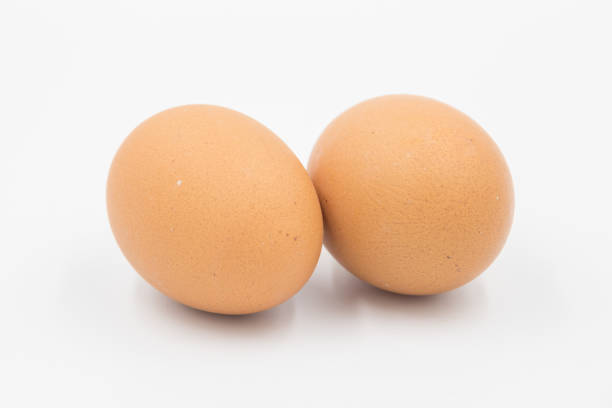 istock Chicken eggs on white background,  egg isolated on the white background, Close-up view of raw chicken eggs, chicken egg isolated on white background, Raw eggs on white background 2183467904