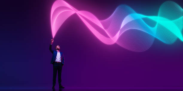 istock Businessman explores dynamic wave of data in digital setting against gradient background in neon light. data flow. Presentation. 2183468129
