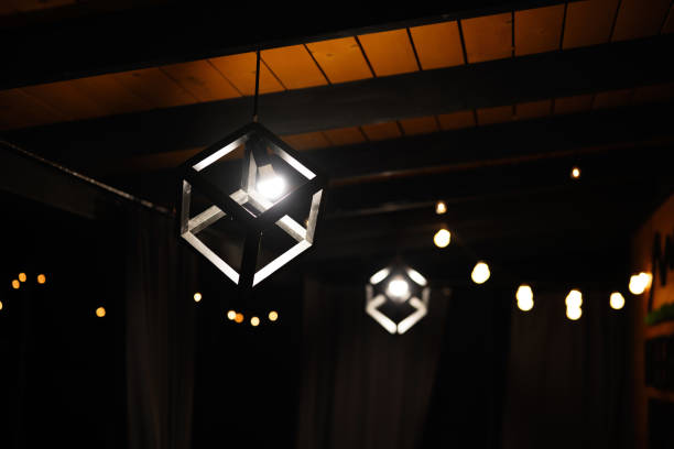 Modern geometric pendant lamp illuminating cozy evening ambiance