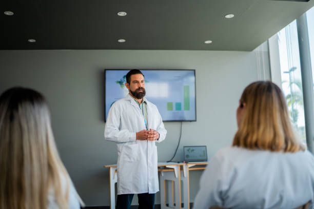 istock Mid adult doctor man talking during seminar 2183475175