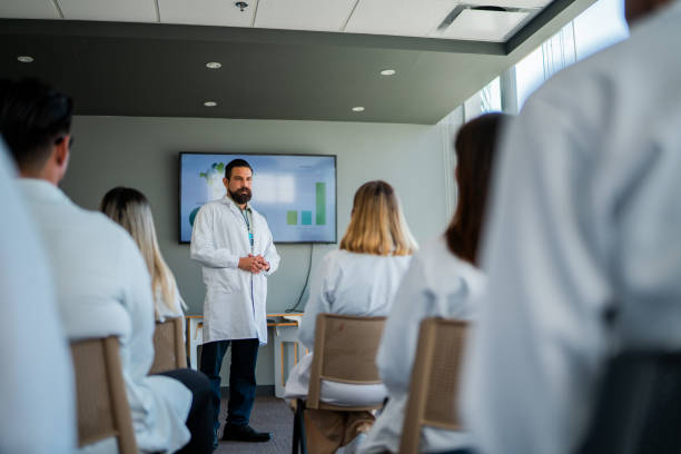 istock Mid adult doctor man talking during seminar 2183475205