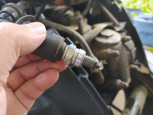 istock The motorcycle repairman is checking the spark plugs on an automatic motorcycle engine 2183476507