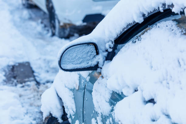 istock A car is covered in snow and has a frosted mirror 2183479243