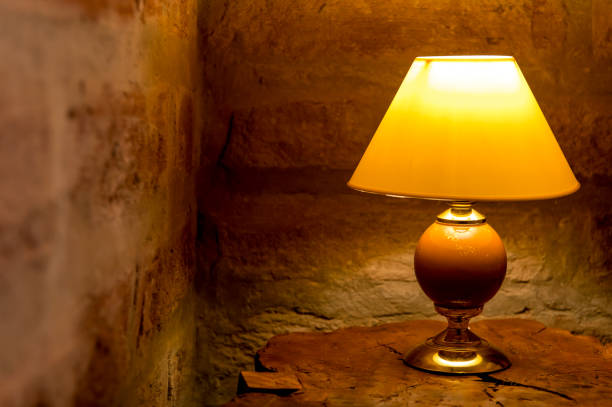 istock wooden headboard with yellow light lamp 2183482344