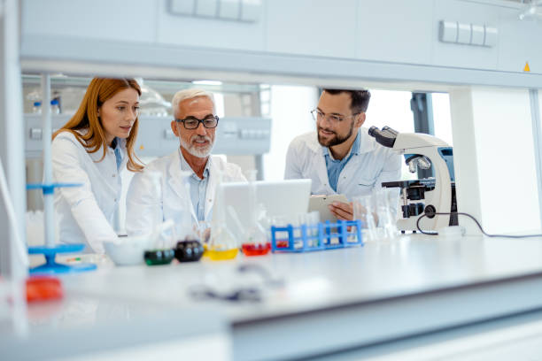 istock Diverse Laboratory Team Working at Laptop in Science Laboratory 2183488991