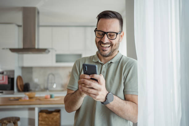 istock Through a screen to the world, a man enjoys digital connectivity 2183489594