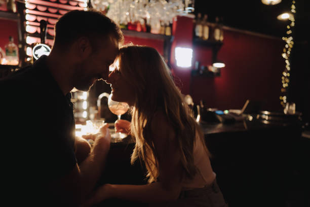 istock Romantic moment between a couple at a bar 2183491440