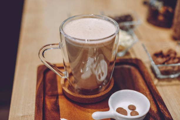 Sweet food: high angle view of a hot chocolate mug isolated on white background. High resolution 42Mp studio digital capture taken with Sony A7rII and Sony FE 90mm f2.8 macro G OSS lens
