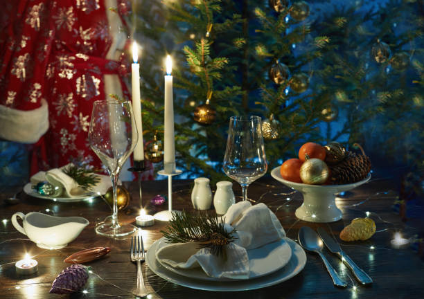 istock Santa Claus against the  a Christmas table and  Christmas tree 2183496496