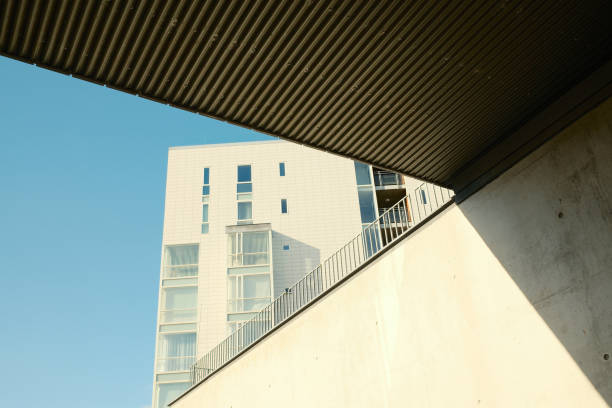 istock Facade of modern building with glass windows and underpass bridge 2183497207