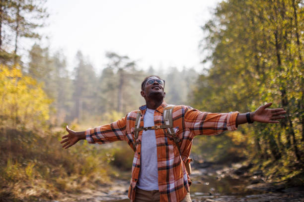 istock Happy peaceful man relaxing in the forest 2183498900