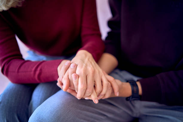 istock middle-aged mother hugs grown-up son 2183499580