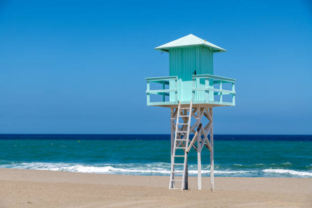 Wooden Lifeguard tower on beach in Spain at dusk